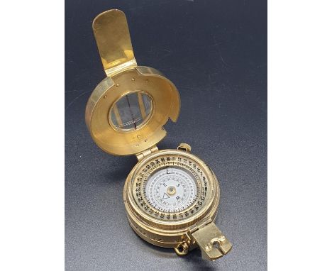 A Brass Compass stamped TG Co Ltd, London, 1940.6 x 10cm 