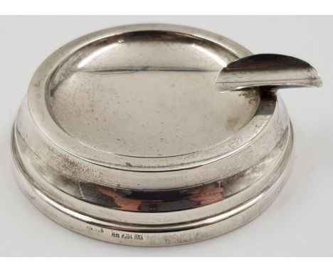 A Vintage Silver Ashtray. Art Deco Design, with stylish cigarette holder attached. 5cm diameter. 41g total weight. 