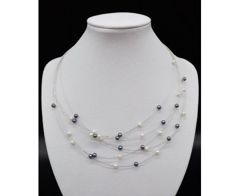 Elegant and delicate Pearl NECKLACE with various shades of pearls, set in 18ct white Gold.   9g    42cm 