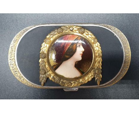 An early gilded enamel snuff box. Beautifully decorated with a portrait centrepiece. Possible hallmarks on inside of lid. 