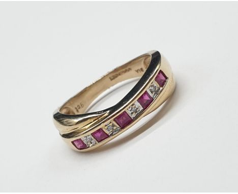 9ct yellow gold diamond and ruby twist ring size M and weighs 3g. 