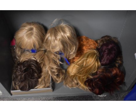 An assorted collection of vintage ladies wigs and hair pieces