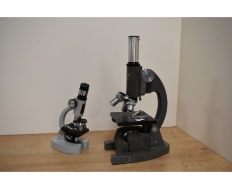 A Opax no.4123 microscope and a Prinz Optics model 180L zoom 100x-750x with user guide.