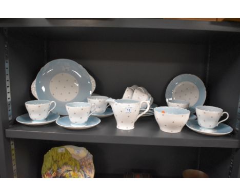 A collection of Shelley 'Pole Star' fine bone china, having white and blue ground with delicate star pattern, including cups 