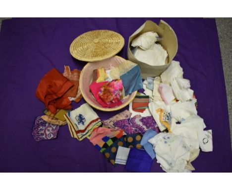 A large collection of vintage and antique handkerchiefs, some bright patterns and novelty designs.