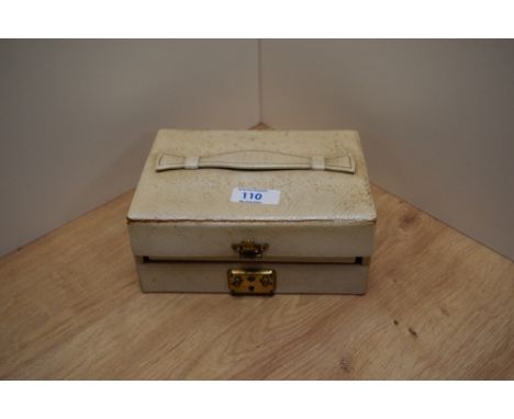 A pale double tier jewellery box containing an assortment of costume jewellery including large statement brooches, Fish &amp;