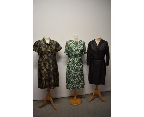 Three vintage 1960s dresses, including abstract patterned day dress with bow to neckline and big mother of pearl buttons.