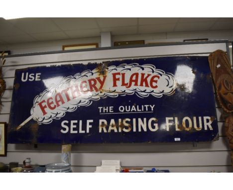 A large vntage enamel sign, 'Use feathery Flake, The Quality Self Raising Flour'. Measuring approx 151cm by 62cm.