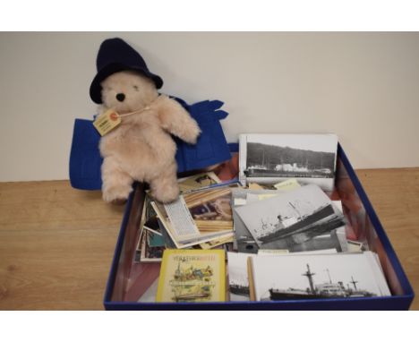 A Gabrielle Designs Ltd Paddington Bear soft toy and a selection of assorted vintage postcards mainly seafaring related.