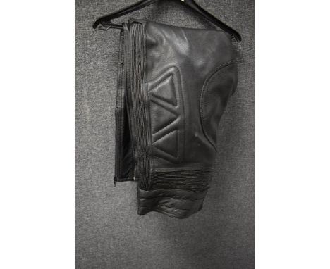 A pair of mens Akito GB 36 short padded leather motorbike trousers.