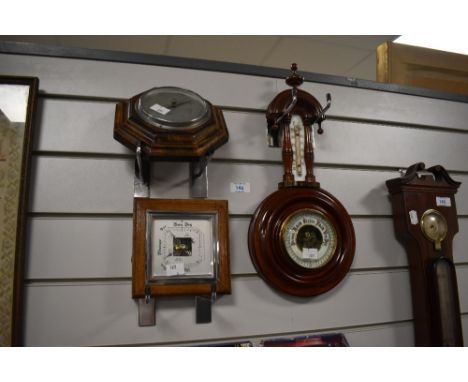 Trio of barometers to include one art deco barometer and others.