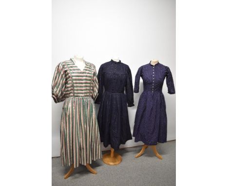 Three vintage dresses, including bohemian style full length dress, navy blue dirndl dress and navy blue wool dress.