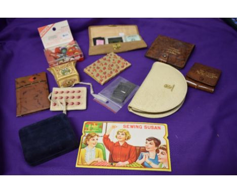 A collection of vintage sewing items, including mending kit for stockings, sharps cases etc.