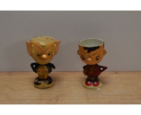 A pair of vintage wooden egg cups, modelled as Enid Blyton characters, Noddy and Big Ears.