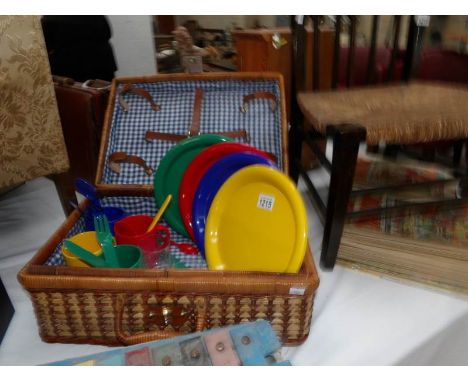 A picnic hamper and contents