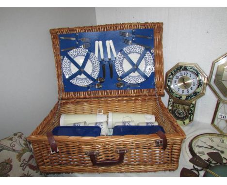 A picnic hamper and contents