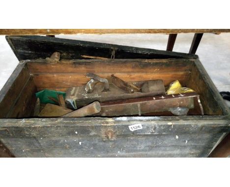 An old wooden chest and contents of vintage tools