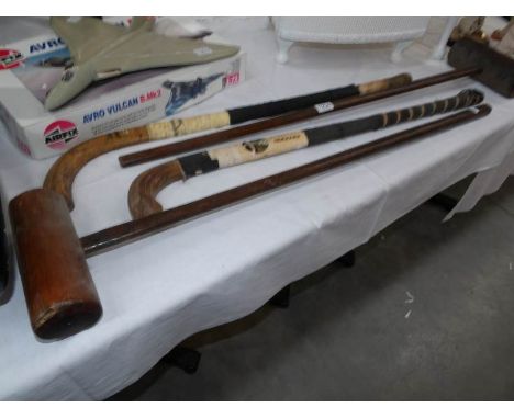 2 vintage hockey sticks and 2 croquet hammers