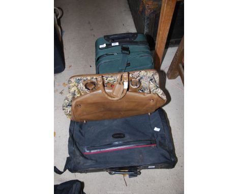 A small trolley case and two more bags, a tapestry bag, suit bags, etc.