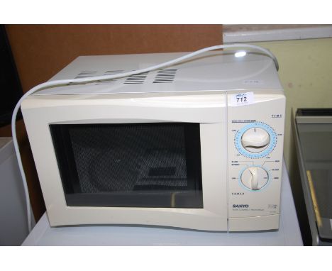 A Sanyo microwave oven 800 watt, compact manual settings.
