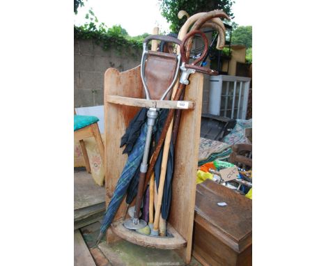 A stick stand with sticks and a shooting stick.
