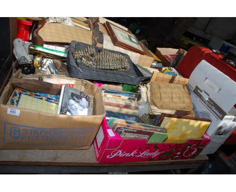 A box of a barometer, cribbage board, A home medic foot plate, picture light, wooden boat, a box of books, etc.