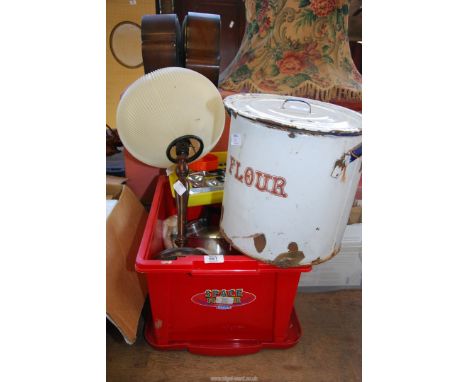 Enamel flour container, cutlery,a camping stove,and table lamp.