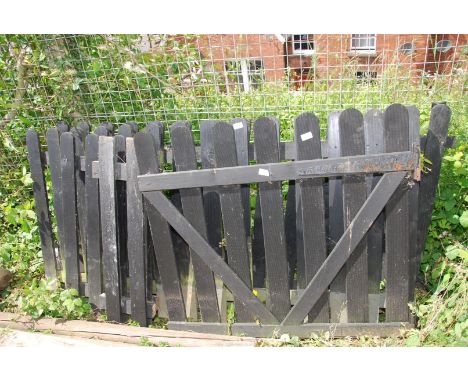 A wooden garden gate, 40" wide x 35" high  with four section of fencing panel, two 69" wide, one 18" wide and one 10" wide.