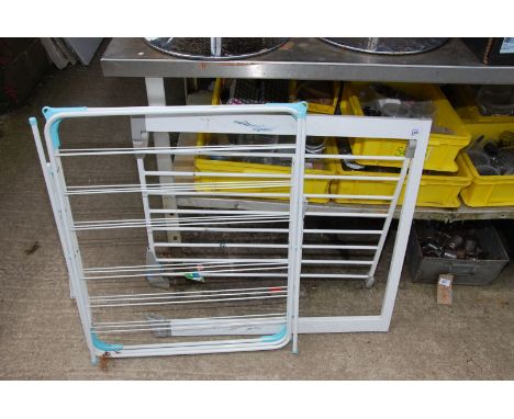 A clothes airer and safety gate.