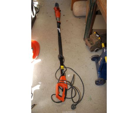 A Black & Decker long reach 240 volt chainsaw, 10'' blade.