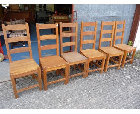 Six heavy ladder-backed Dining chairs.