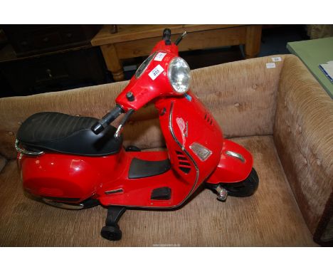 A child's red Scooter/Vespa, (no charger).