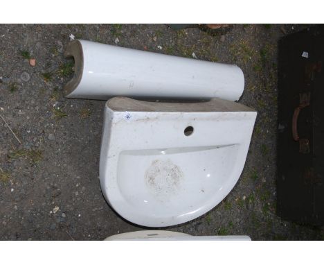 A hand basin and pedestal.