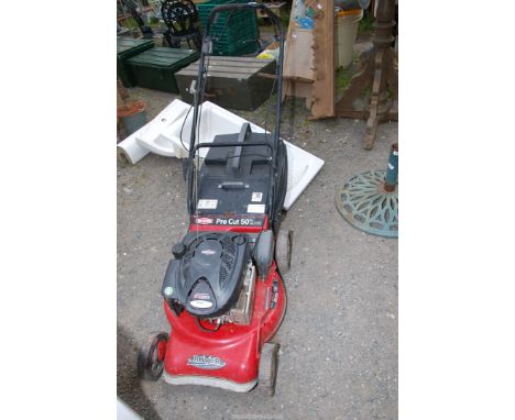 A Rover Briggs Stratton 4 stroke engine x 190 cc propelled lawnmower, good compression with grass box.