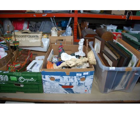 Three boxes of prints, china ornaments, clocks, projector, an old boat, etc.