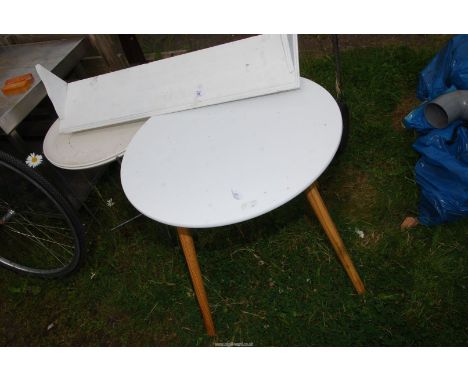 Two circular tables and a wooden shelf.