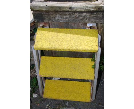 A three rung step stool with anti slip surface.