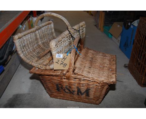 A wicker picnic hamper basket (empty) and a wicker flower trug.