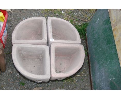 A four section planter, 26'' diameter x 9'' deep.