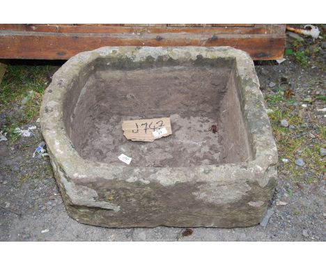 A stone tough/planter, 21" wide x 17" deep x 9 1/2" high.