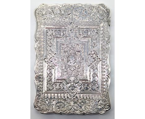 A Victorian William Shakespeare silver card case, chased and etched decor, vacant cartouche to one side, a portrait of Shakes