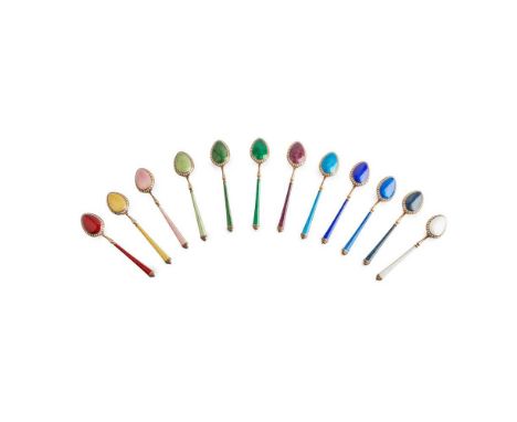 A cased matched set of silver gilt and enamelled Russian coffee spoons circa 1910, St Petersburg, each gilt, white enamel dot