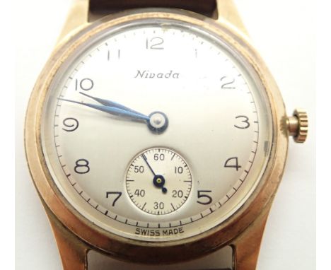Gents Nivada 9ct gold wristwatch on a leather strap  CONDITION REPORT: This item was working at lotting up Item does not wind
