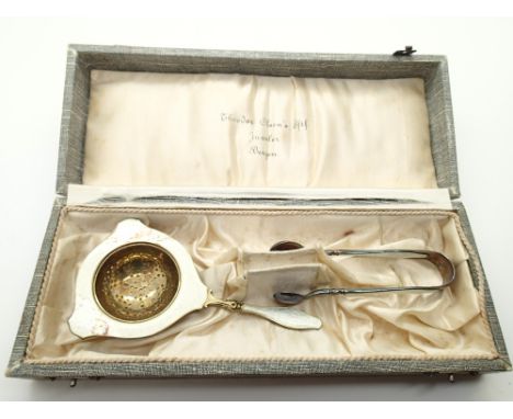 Cased silver and guilloche enamel strainer and tongs set 