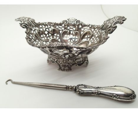 Hallmarked silver pierced bon bon dish 87g and a silver handled button hook various assay marks  CONDITION REPORT: No apparen