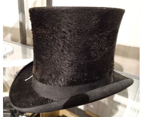 Antique top hat by J Wilks and Son of Worcester  CONDITION REPORT: The item has some worn holes around the edges of the hat, 