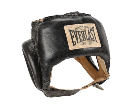BRUCE LEE - Bruce Lee's Autographed HeadguardBruce Lee's autographed Everlast headguard. Lee wore this headguard during sparr