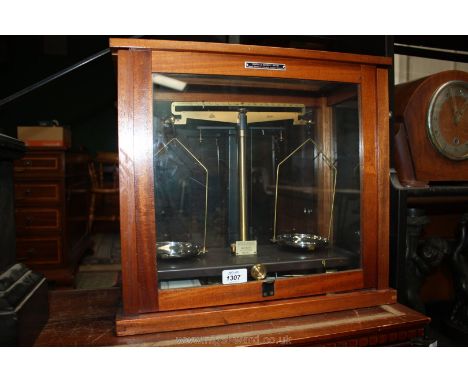 A set of chemist's Scales in a cabinet 