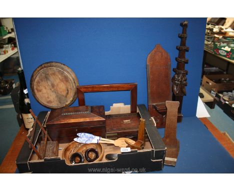 A box of treen including a small writing box (a/f), a tea caddy (a/f), a recipe book stand, miscellaneous wooden spoon, plate