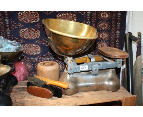A set of balance Scales with brass pan (no weights), a wooden pot with three brushes and a Holy Communion book